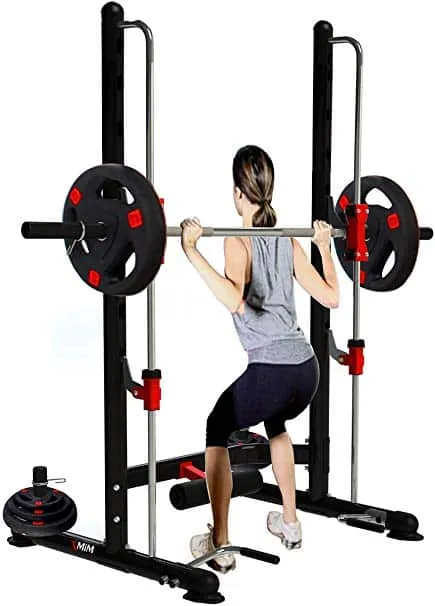 Woman performing squat on Smith machine