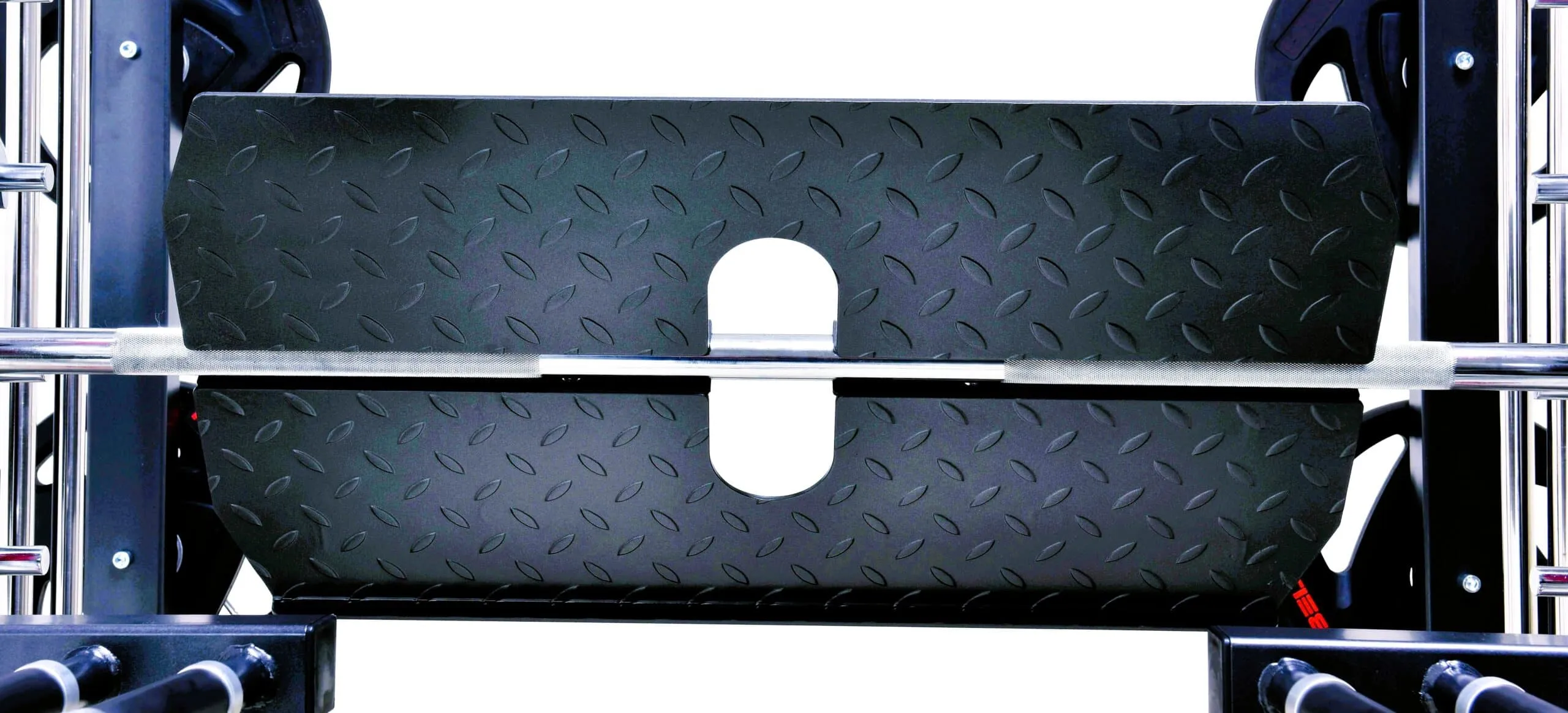 Smith machine barbell with safety spotter arms