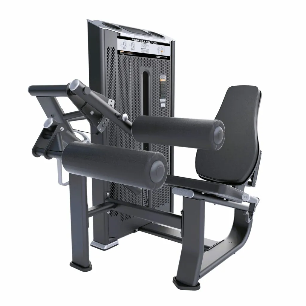 Seated leg curl exercise machine in use at gym