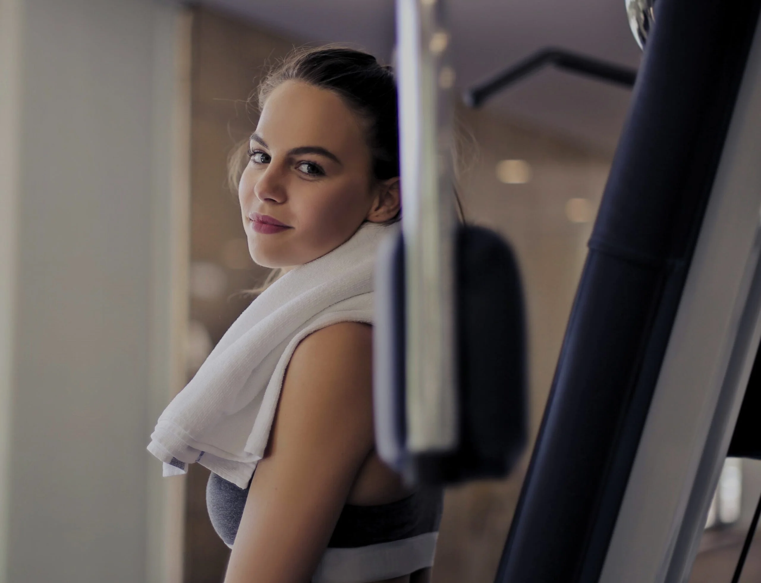 Woman resting after workout in gym